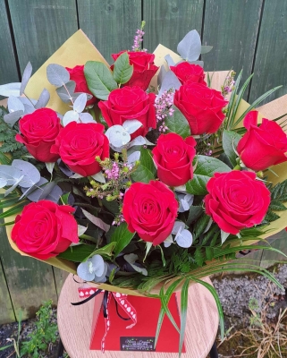 Dozen red roses hand tied