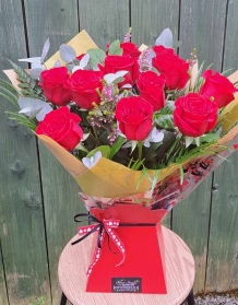 Dozen red roses hand tied
