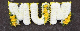 MUM  based lettering yellow spray